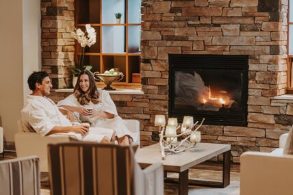 An engaged couple relaxing in 100 Fountain Spa in Niagara-on-the-Lake.