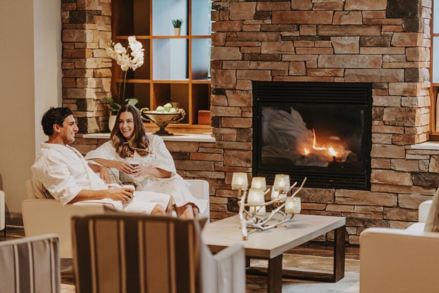 An engaged couple relaxing in 100 Fountain Spa in Niagara-on-the-Lake.