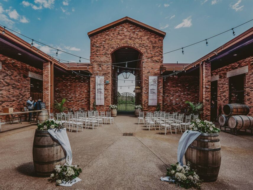 Courtyard Ceremony The Hare Wine Co. Wedding Niagara on the Lake