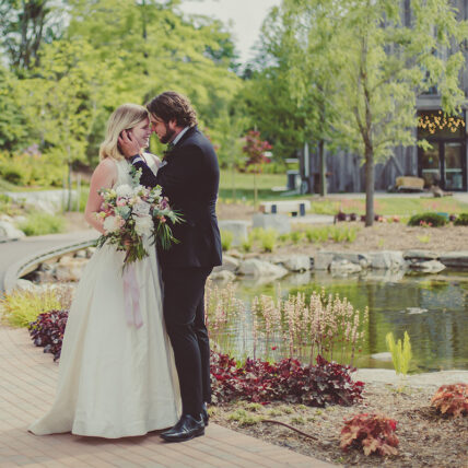 A couple eloping in The Gardens at Pillar and Post.