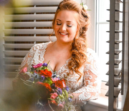 A bride holding a winter wedding bouquet