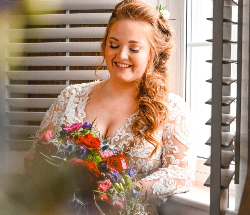 A bride holding a winter wedding bouquet