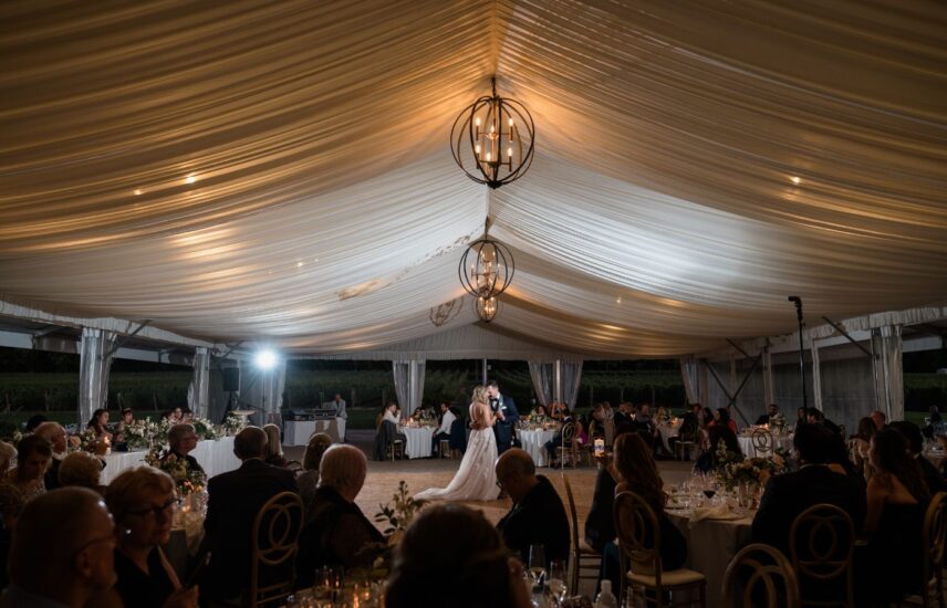 A couple dances under the chandelier at Chateau des Charmes winery