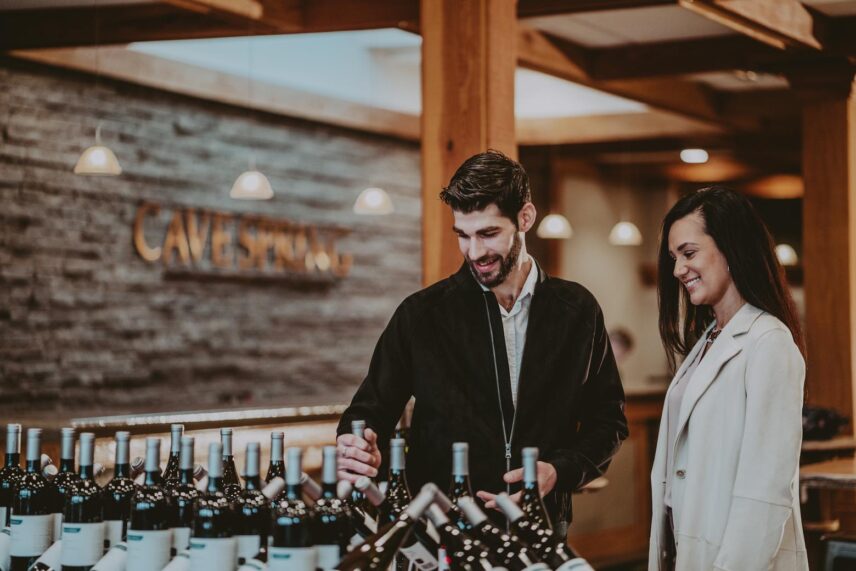 A couple visiting Cave Spring Vineyards on a wine tour.