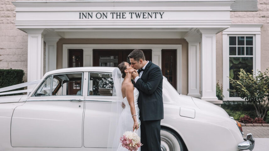 A couple at the entrance of the Inn On The Twenty hotel in Jordan Village.