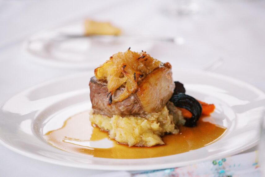 Beef served with potatoes at a wedding hosted by Vintage Hotels.