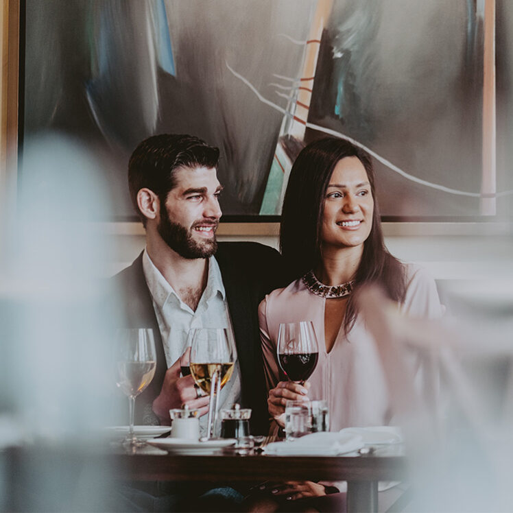 Couple having dinner together at Inn On The Twenty in Jordan Village