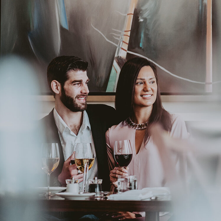 A couple enjoying the flavours of Niagara wine country at the Inn On The Twenty Restaurant in Jordan, Ontario.