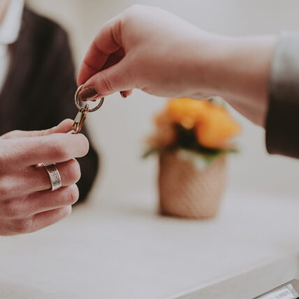 A guest of Inn On The Twenty hotel grabbing their room key to check in.