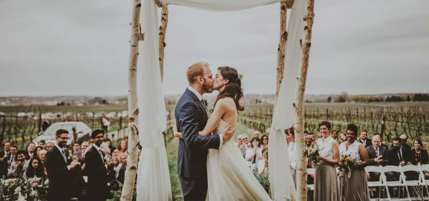 Couple having a vineyard ceremony at Inn On The Twenty in Jordan Village