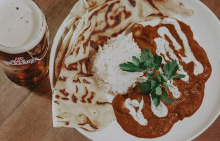 Chicken curry with rice and naan and beer at Jordan House Tavern at Jordan House in Jordan Village