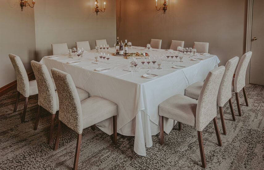 Table setting for Wine Library conference venue at Inn On The Twenty in Jordan Village