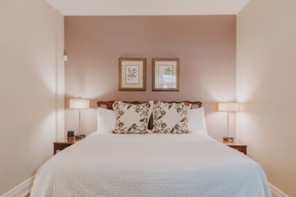 Lush king size bed in Signature Guest Suite at Inn On The Twenty in Jordan Village
