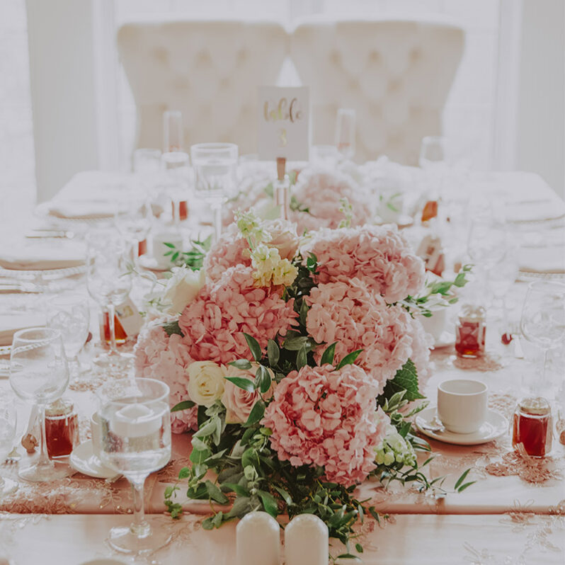 florals on the head table at a wedding at inn on the twenty