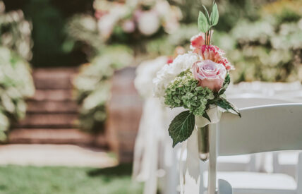 Wedding aisle floral arrangements at The Escarpment Site venue at Inn On The Twenty in Jordan Village