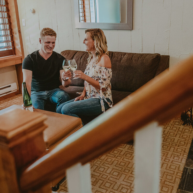 Couple unwinding in their hotel accommodations at Millcroft Inn & Spa in Caledon, Ontario