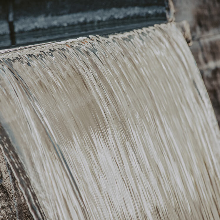 Water cascading into a hot spring pool at Millcroft Spa