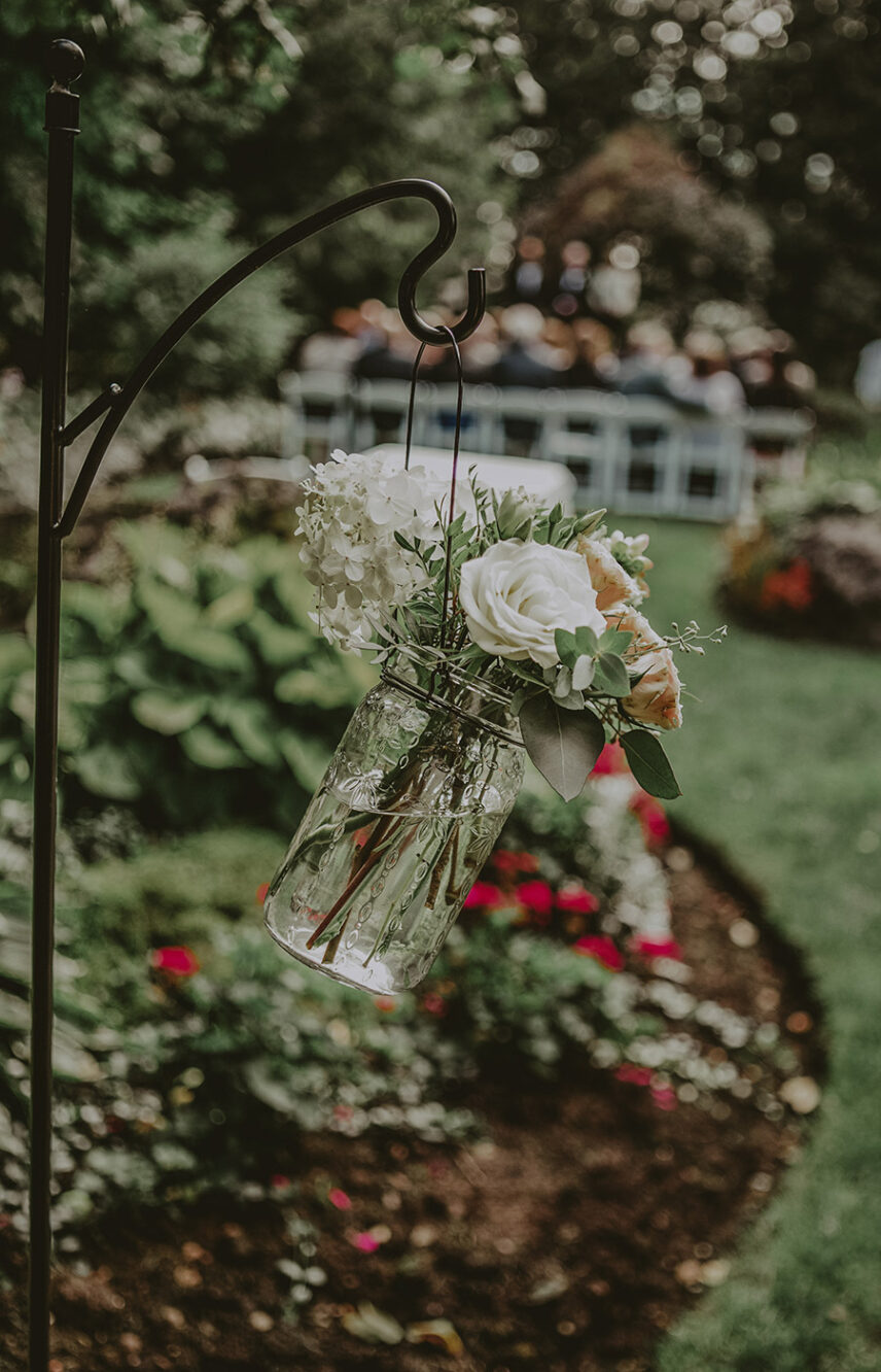 Flower arrangements at Riverside Wedding Garden venue at Millcroft Inn & Spa in Caledon