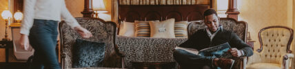 Man enjoying luxury accommodations in Niagara on the Lake at Prince of Wales hotel.
