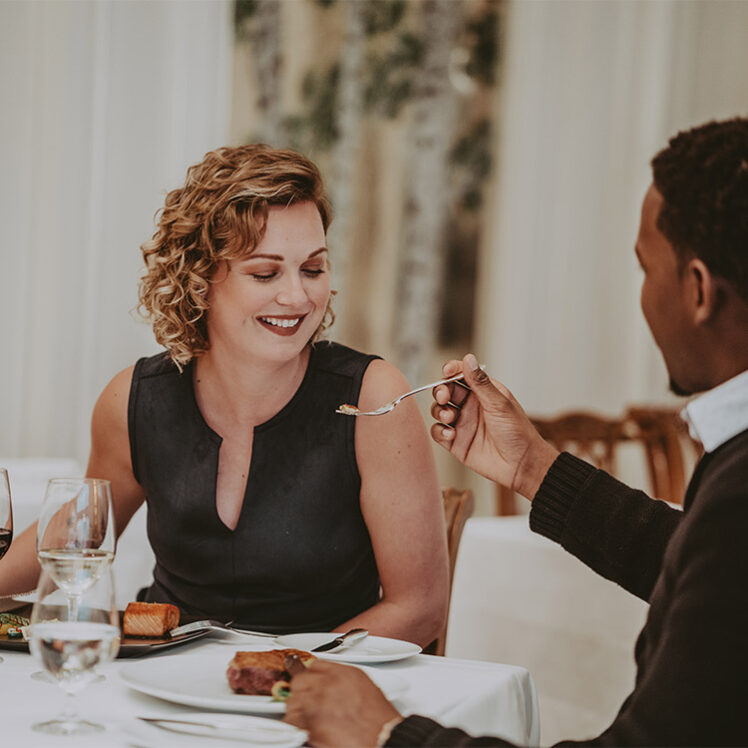 Couple sharing a romantic dinner at Noble Restaurant at the Prince of Wales Hotel in Niagara on the Lake