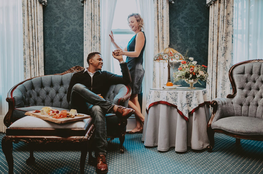 Couple enjoying the Premium Guest Room experience at the Prince of Wales Hotel