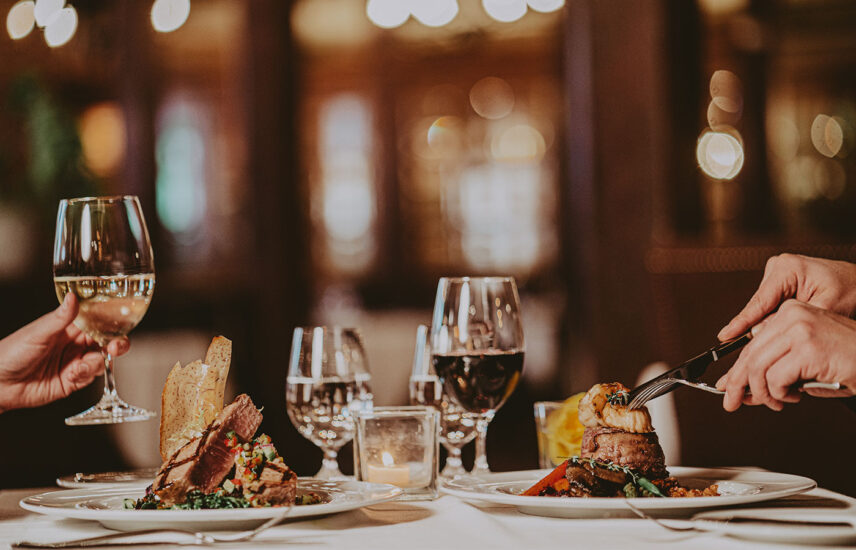Two individuals dining at Cannery Restaurant at the Pillar & Post Hotel in Niagara-on-the-Lake