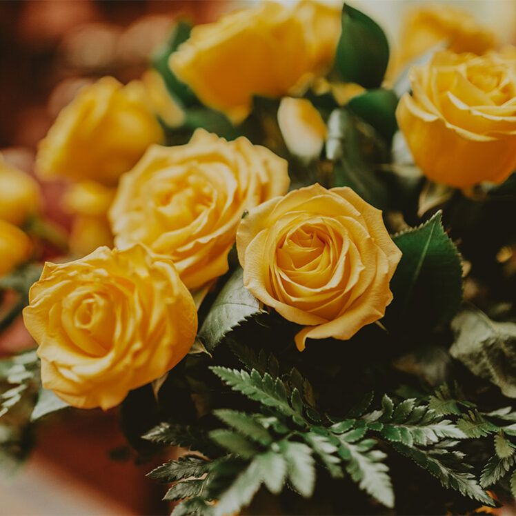 Elegant yellow roses placed in Cannery Restaurant at the Pillar & Post in Niagara-on-the-Lake