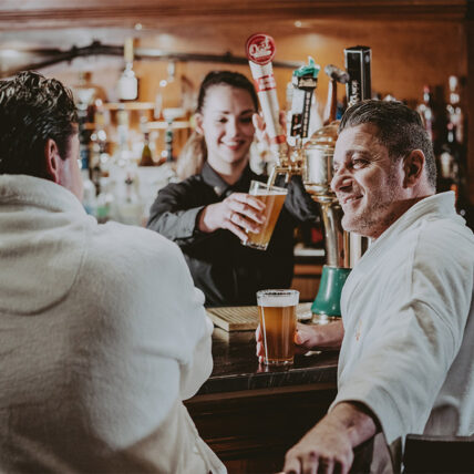 Friends share a drink at the Vintage Wine Bar and Lounge at the Pillar & Post Hotel in Niagara-on-the-Lake