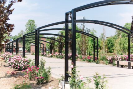 The arches in Gardens at Pillar and Post during the summer.