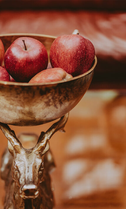 A bowl of apples as the centerpiece of a meeting table inside the Pillar and Post hotel in Niagara-on-the-Lake.