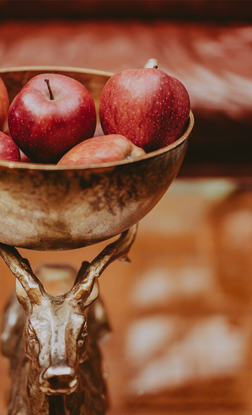 A bowl of apples as the centerpiece of a meeting table inside the Pillar and Post hotel in Niagara-on-the-Lake.