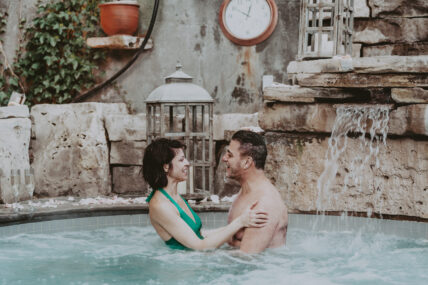 A couple relaxing in the hot spring pool at 100 Fountain Spa over March Break.