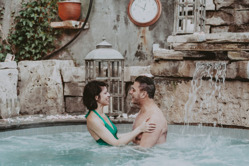 A couple relaxing in the hot spring pool at 100 Fountain Spa over March Break.