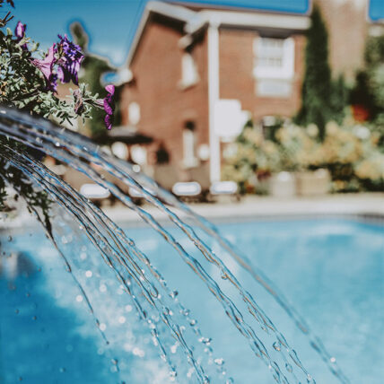 Poolside Patio in-pool waterfall at the Pillar & Post Hotel in Niagara-on-the-Lake