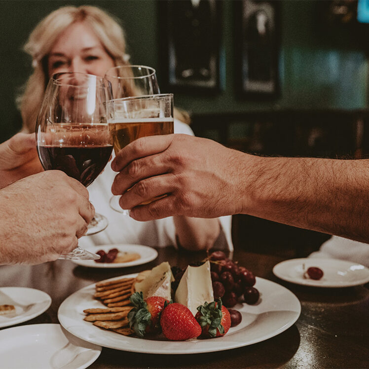 Group of individuals dining at the Vintage Wine Bar & Lounge at the Pillar & Post in Niagara-on-the-Lake