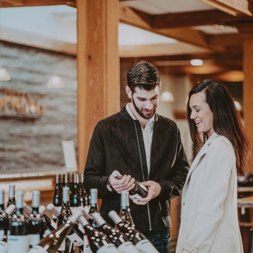 A couple exploring a wine collection at Inn on the Twenty in Niagara-on-the-Lake, Ontario.