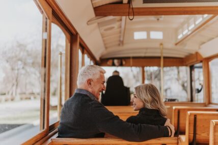 A couple attending the Suds and Sprits tour aboard the Vintage Hotels trolley over March Break.