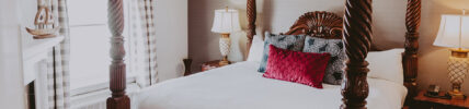 Lush bedding in Queen's Landing hotel room in Niagara-on-the-Lake