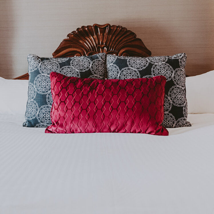 Comfortable bedding in a guest room at the Queen’s Landing hotel in Niagara-on-the-Lake.