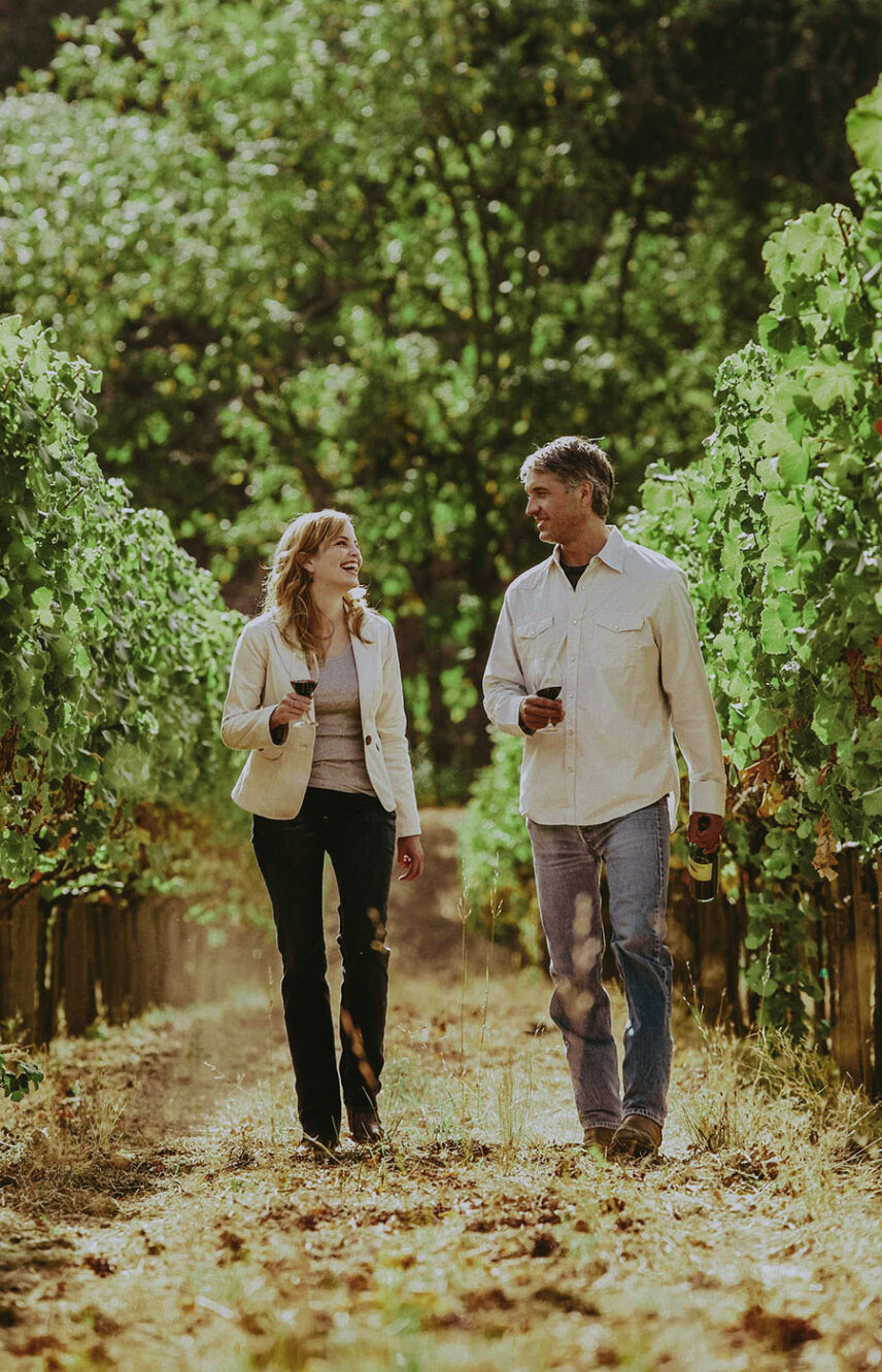 Couple touring vineyards while exploring things to do in Niagara-on-the-Lake