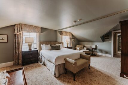 Upper Cottage guest suite bed at the Queen's Landing hotel in Niagara-on-the-Lake.