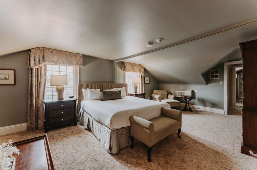 Upper Cottage guest suite bed at the Queen's Landing hotel in Niagara-on-the-Lake.