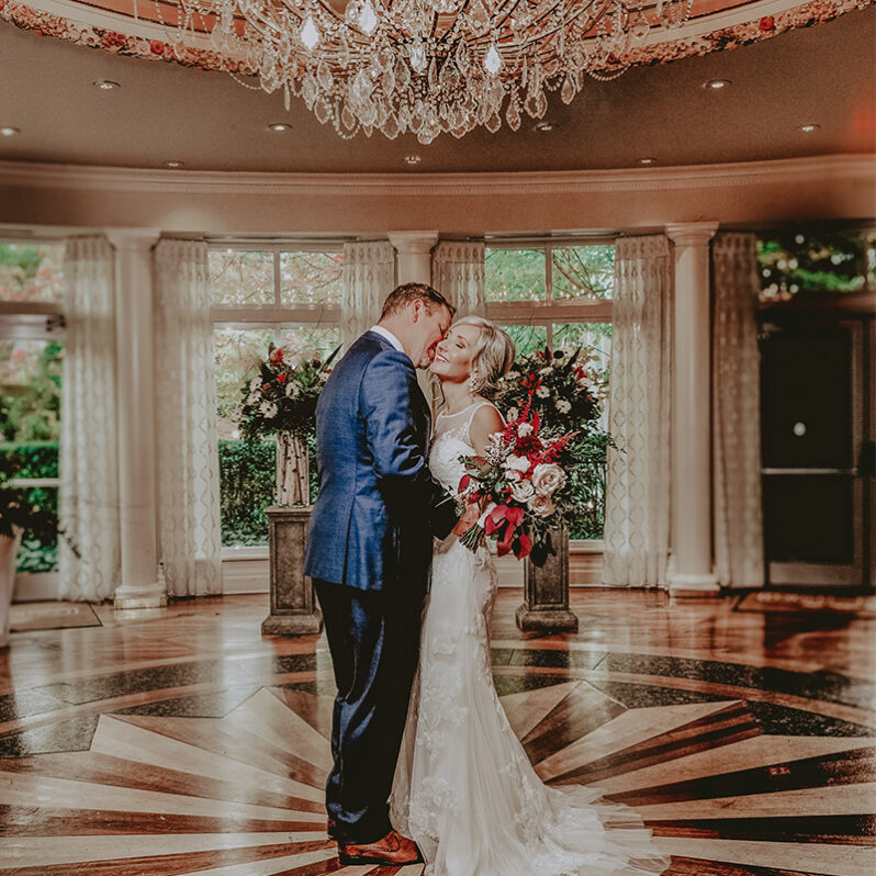Couple celebrating their wedding in a venue at the Queens Landing Hotel in Niagara-on-the-Lake