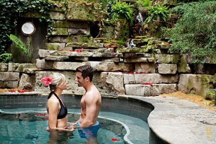 Couple in a pool at 100 Fountain Spa at Pillar and Post in Niagara on the Lake