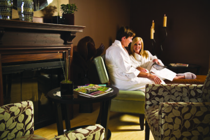 A couple relaxing in the lounge at Secret Garden Spa in Niagara-on-the-Lake.