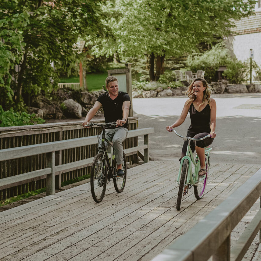 Riding bikes over the iconic bridge at Millcroft Inn & Spa