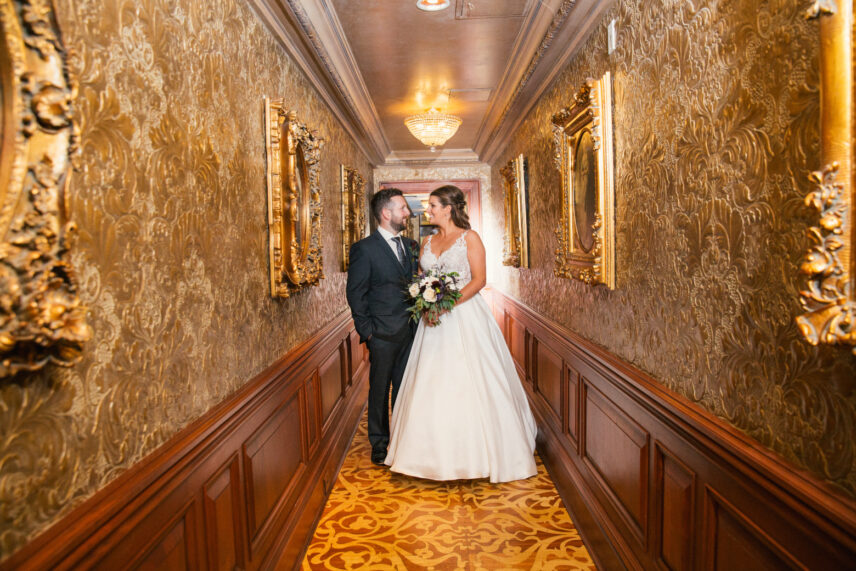 Newlyweds in the halls of Prince of Wales wedding venue in Niagara