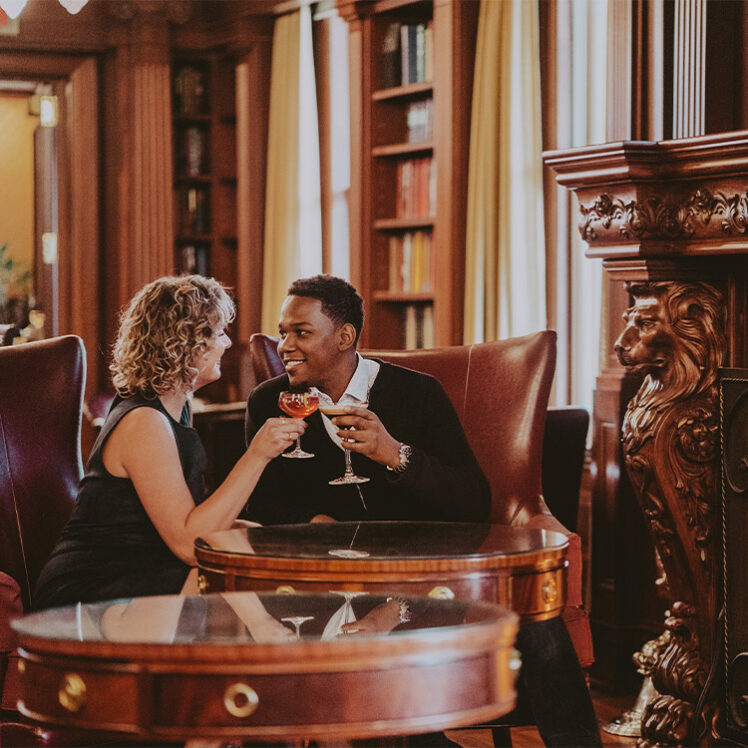 Man and woman drinking together at the Churchill Lounge at Prince of Wales in Niagara-on-the-Lake