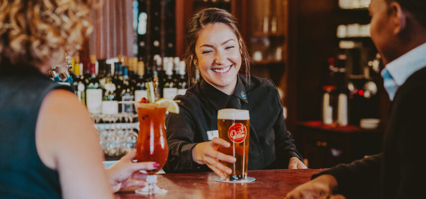 Bartender serving drinks at Churchill Lounge at Prince of Wales in Niagara-on-the-Lake