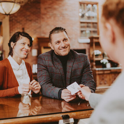 Man and woman checking in at Pillar and Post in Niagara-on-the-Lake